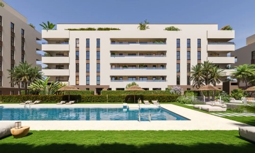 Piscina exterior rodeada de zonas verdes y solárium. Un refugio de frescor y tranquilidad en el corazón de Entrenúcleos, con acabados de alta calidad propios de las promociones de Grupo Insur.